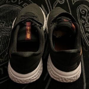 Nike walking/Running shoes for women width W with zipper on the side and Velcro.